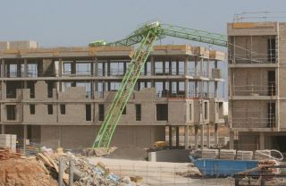 A crane falls in Manege due to strong wind