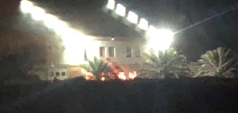 Firefighters extinguish a fire in La Santa hostel