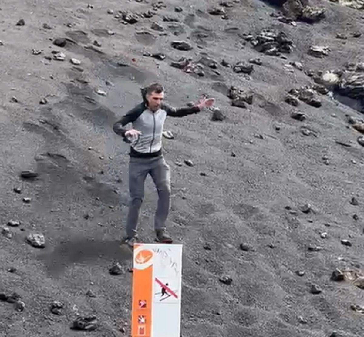 A tourist sliding through a restricted area