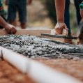 Construction workers working with cement