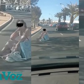 Imagen de la mujer sentada en la carretera de la Vía Medular