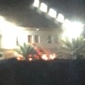 Firefighters extinguish a fire in La Santa hostel