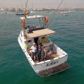 Txaro Tomasena junto al juez árbitro, el patrón del barco y su entrenadora